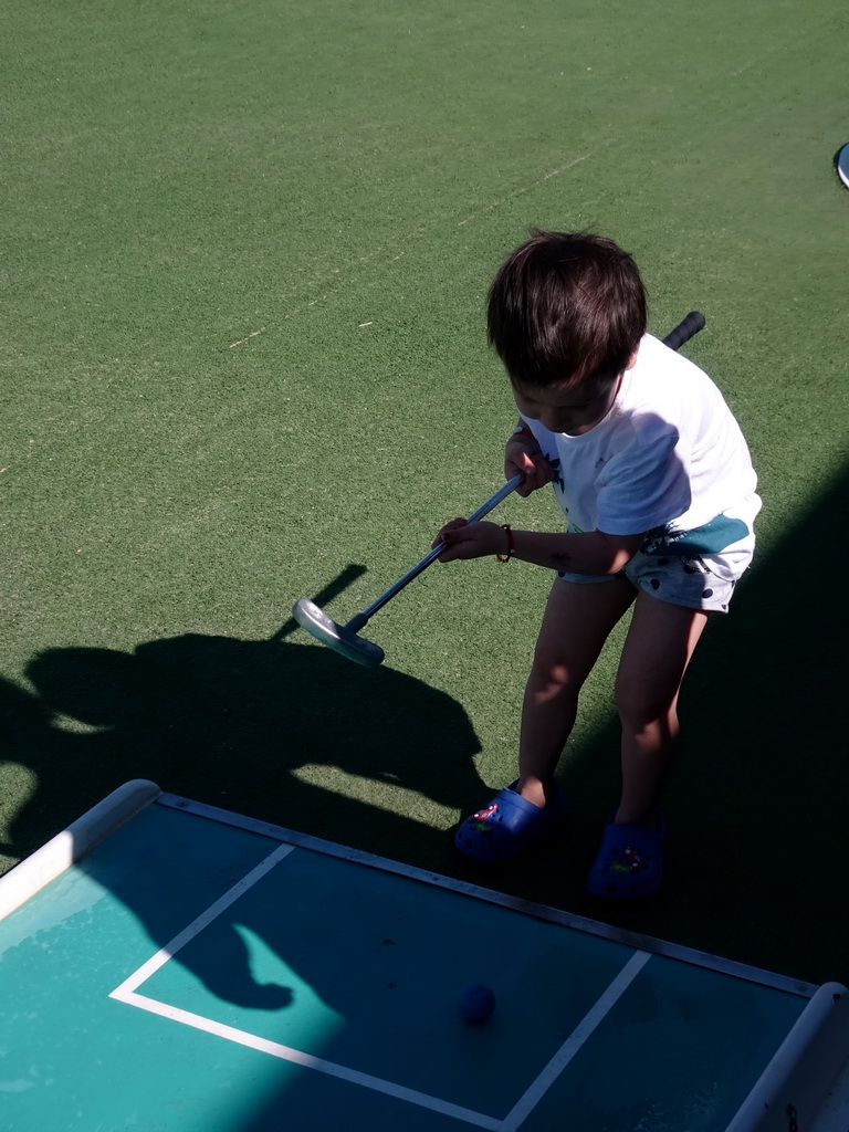 Max playing minigolf at the Minigolf Court at the Blue Lagoon Resort