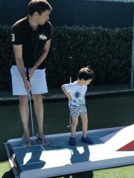 Tim and Max playing minigolf at the Minigolf Court at the Blue Lagoon Resort