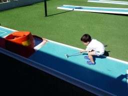 Max playing minigolf at the Minigolf Court at the Blue Lagoon Resort