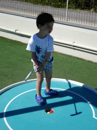 Max playing minigolf at the Minigolf Court at the Blue Lagoon Resort