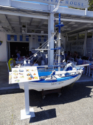Scale model of a boat in front of the Mesogios restaurant at the Akti Kountouriotou street