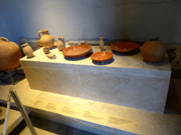 Vases, amphoras and plates at the Casa Romana museum, with explanation