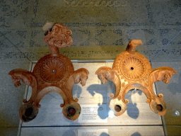 Clay red-glazed lamps of Cnidian type at the Casa Romana museum, with explanation