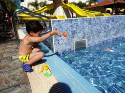 Max playing with animal toys at the Children`s Pool at the Blue Lagoon Resort