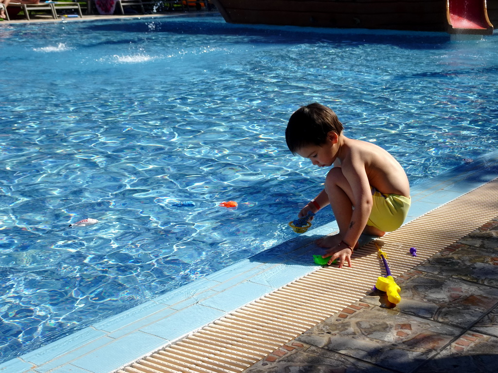 Max playing with animal toys at the Children`s Pool at the Blue Lagoon Resort