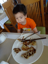 Max eating pancake at the Nisos Restaurant at the Blue Lagoon Resort