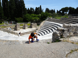 Max climbing the stairs at the Roman Odeum