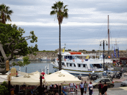 Boat in the Limenas Ko harbour and the Neratzia Castle, viewed from the White Stairs of Kos