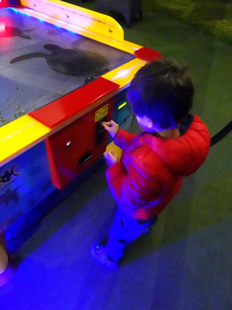 Max at a disc slide game at the Avra Tent at the Blue Lagoon Resort, by night