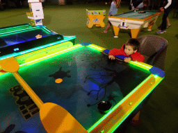 Max at a disc slide game at the Avra Tent at the Blue Lagoon Resort, by night