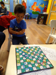 Max playing a board game at the Kids Club at the Blue Lagoon Resort