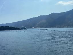 Boats at the Bay of Kotor and the town of Prcanj, viewed from the tour bus on the E65 road at the town of Ljuta