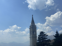 The tower of the Church of Saint Eustahije at the town of Dobrota, viewed from the tour bus on the E65 road