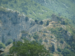 Walls and the Fortress of St. John, viewed from the tour bus on the E65 road at the town of Dobrota