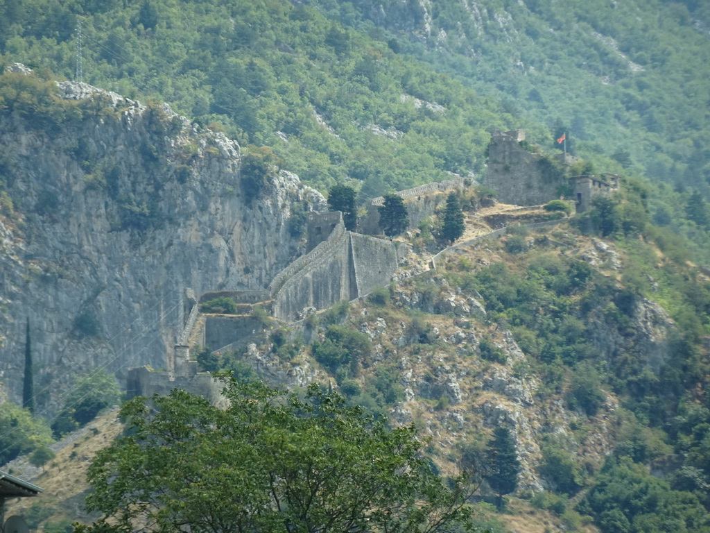 Walls and the Fortress of St. John, viewed from the tour bus on the E65 road at the town of Dobrota