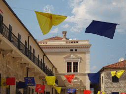 Flags hanging over the northwest side of the Square of the Arms