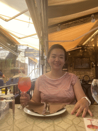 Miaomiao with a cocktail at the terrace of the Regina Del Gusto restaurant