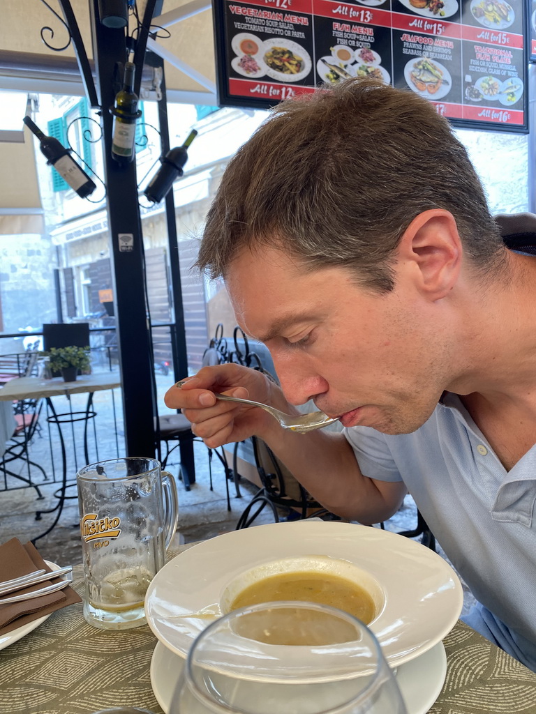 Tim eating soup at the terrace of the Regina Del Gusto restaurant