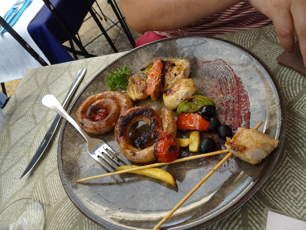 Meat and fries at the terrace of the Regina Del Gusto restaurant