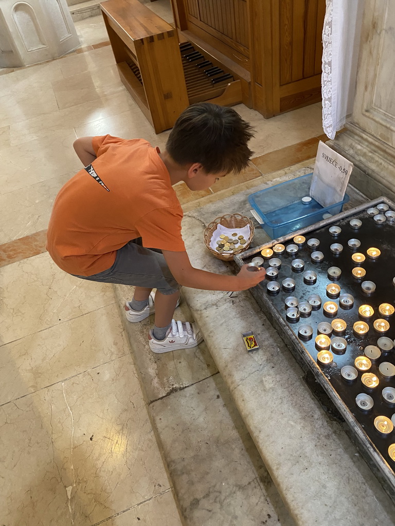 Max lighting a candle at St. Tripun`s Cathedral