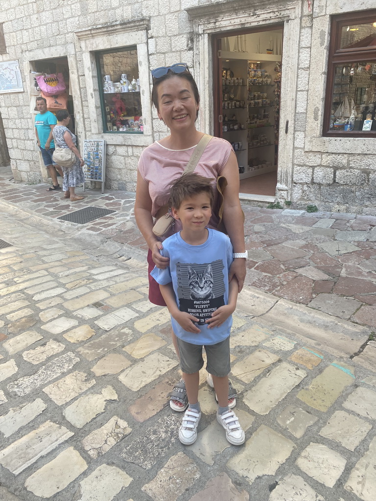 Miaomiao and Max with a cat shirt in front of a shop at the southeast side of the Cat Park