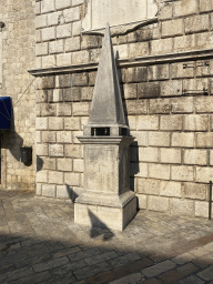 Column in front of the Clock Tower at the Square of the Arms