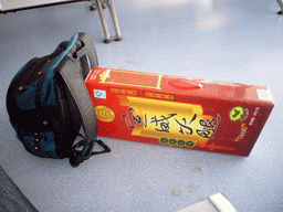 Backpack and box with pig leg, at Kunming Wujiaba International Airport