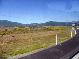 Hills and grassfield, viewed from the taxi to the Smithfield Skyrail Terminal of the Skyrail Rainforest Cableway