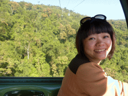 Miaomiao in a Skyrail Rainforest Cableway gondola, with a view on the tropical rainforest west of Smithfield