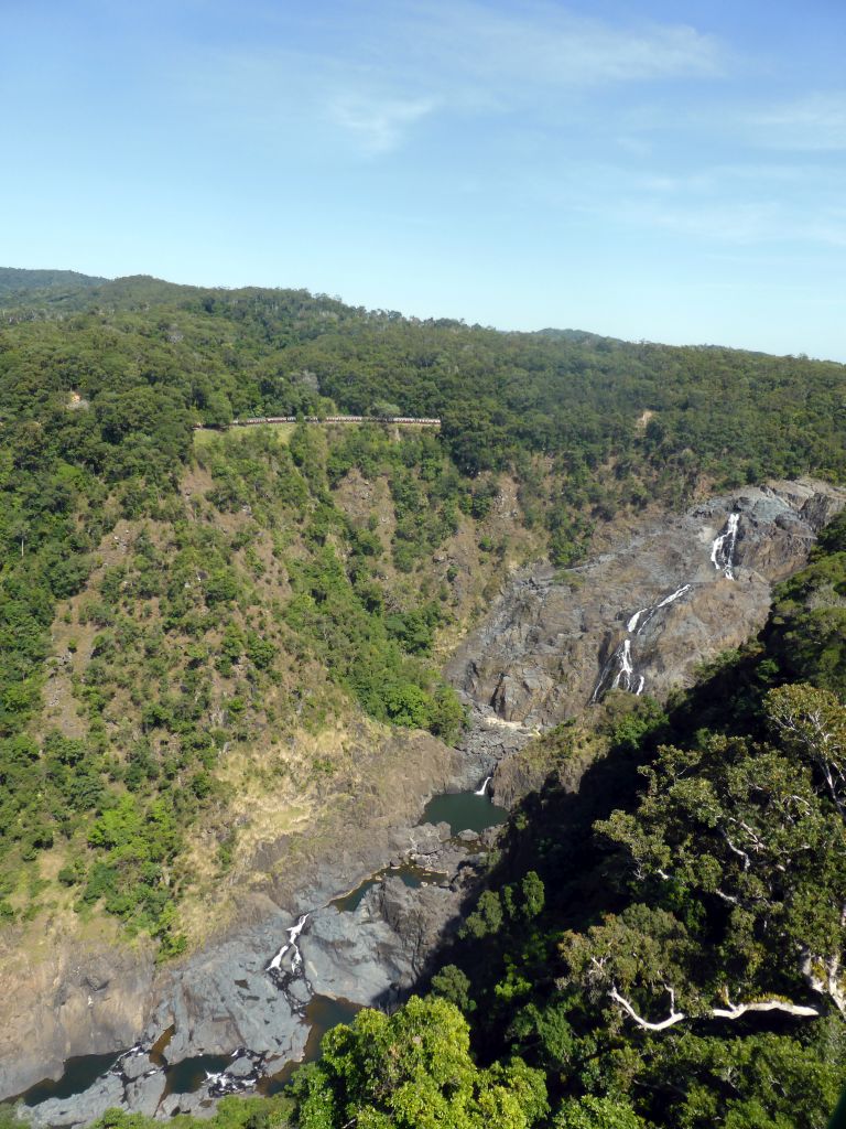 The Kuranda Scenic Railway train at the Barron Falls Railway Station and Barron Falls, viewed from the Skyrail Rainforest Cableway gondola