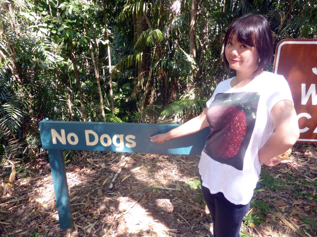 Miaomiao with `No Dogs` sign at the Jumrum Creek Walk