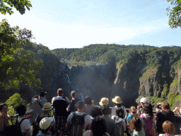 Tourists at the viewing point at the Barron Falls Railway Station, with a view on the Barron Falls
