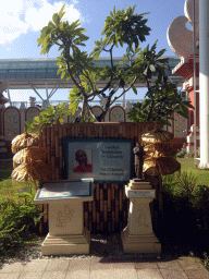 Plague and statue of Sri Chinmoy in the garden in front of the Ngurah Rai International Airport