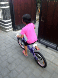 Child on a bike at a small street at the south side of town