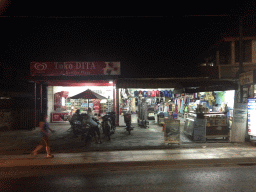 Front of the Toko Dita store at the Jalan Kartika Plaza, by night