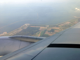 The north side of Lelystad, the Houtribdijk dam, the IJsselmeer lake and the Markermeer lake, viewed from the airplane from Jakarta to Amsterdam