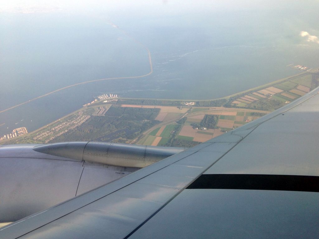 The north side of Lelystad, the Houtribdijk dam, the IJsselmeer lake and the Markermeer lake, viewed from the airplane from Jakarta to Amsterdam