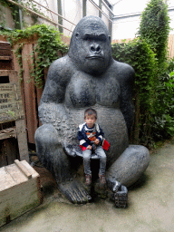 Max with a Gorilla statue at the Kids Jungle at the Berkenhof Tropical Zoo