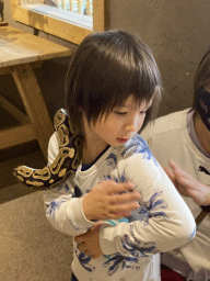 Max with a snake at the Nature Classroom at the Berkenhof Tropical Zoo