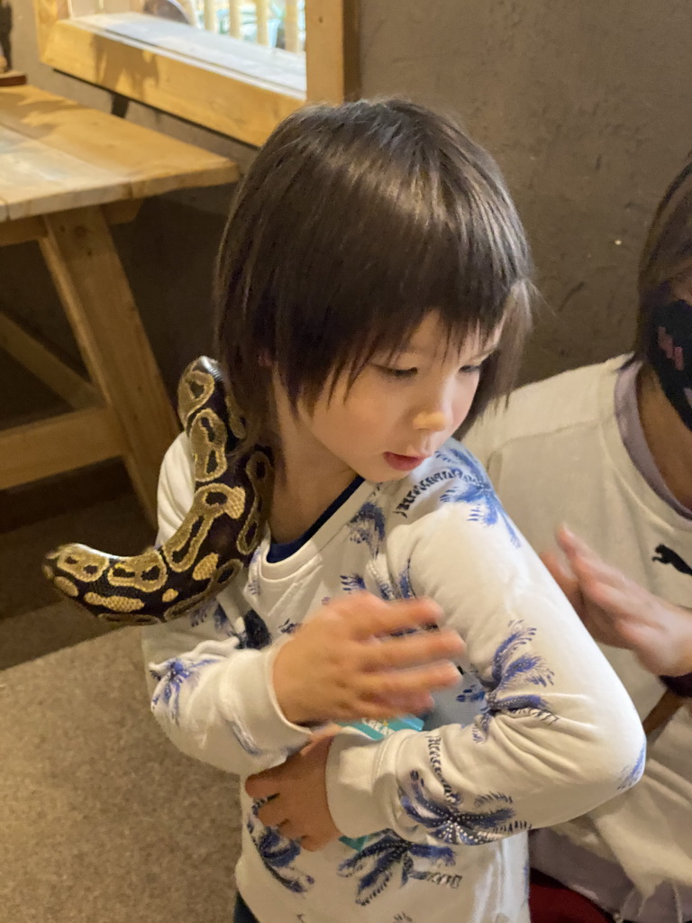 Max with a snake at the Nature Classroom at the Berkenhof Tropical Zoo