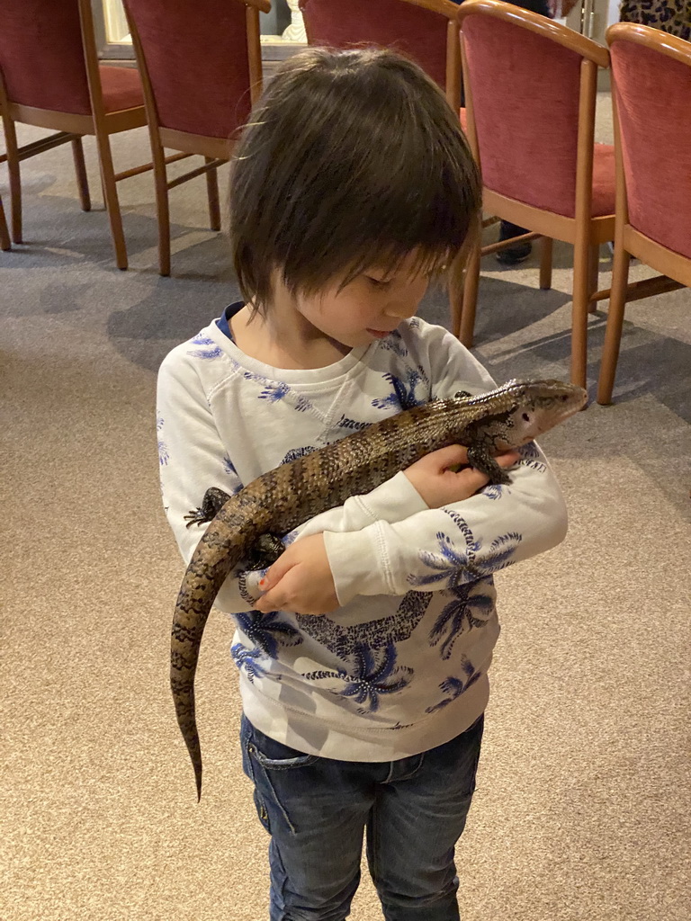 Max with a Blue-tongued Skink at the Nature Classroom at the Berkenhof Tropical Zoo