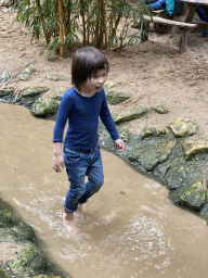 Max walking through the water at the playground at the Kids Jungle at the Berkenhof Tropical Zoo