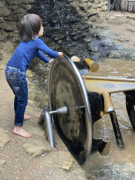 Max playing with a water wheel at the Kids Jungle at the Berkenhof Tropical Zoo