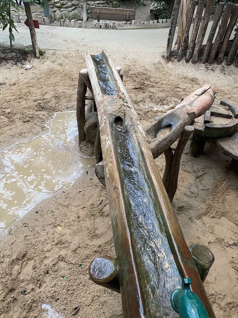 Water flowing from a water pump at the Kids Jungle at the Berkenhof Tropical Zoo