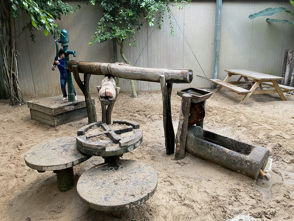 Max playing with a water pump at the Kids Jungle at the Berkenhof Tropical Zoo