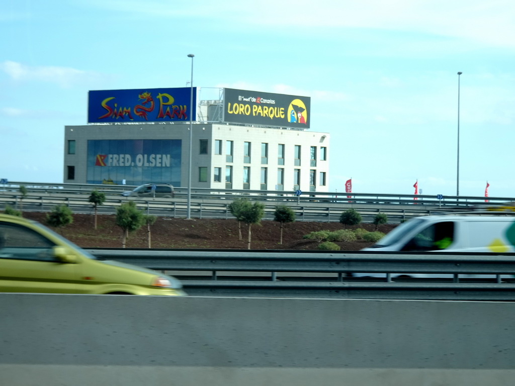 Building with commercials for Siam Park and Loro Parque at the interjunction of the TF-1 road just south of the city of Santa Cruz de Tenerife