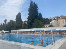 Miaomiao and Max at the outdoor swimming pool of the Grand Hotel Park