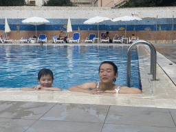 Miaomiao and Max at the outdoor swimming pool of the Grand Hotel Park