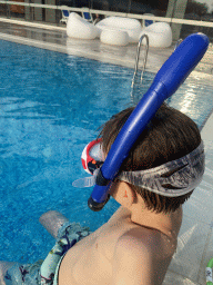 Max with goggles and snorkel at the outdoor swimming pool of the Grand Hotel Park