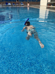 Max with goggles and snorkel at the outdoor swimming pool of the Grand Hotel Park